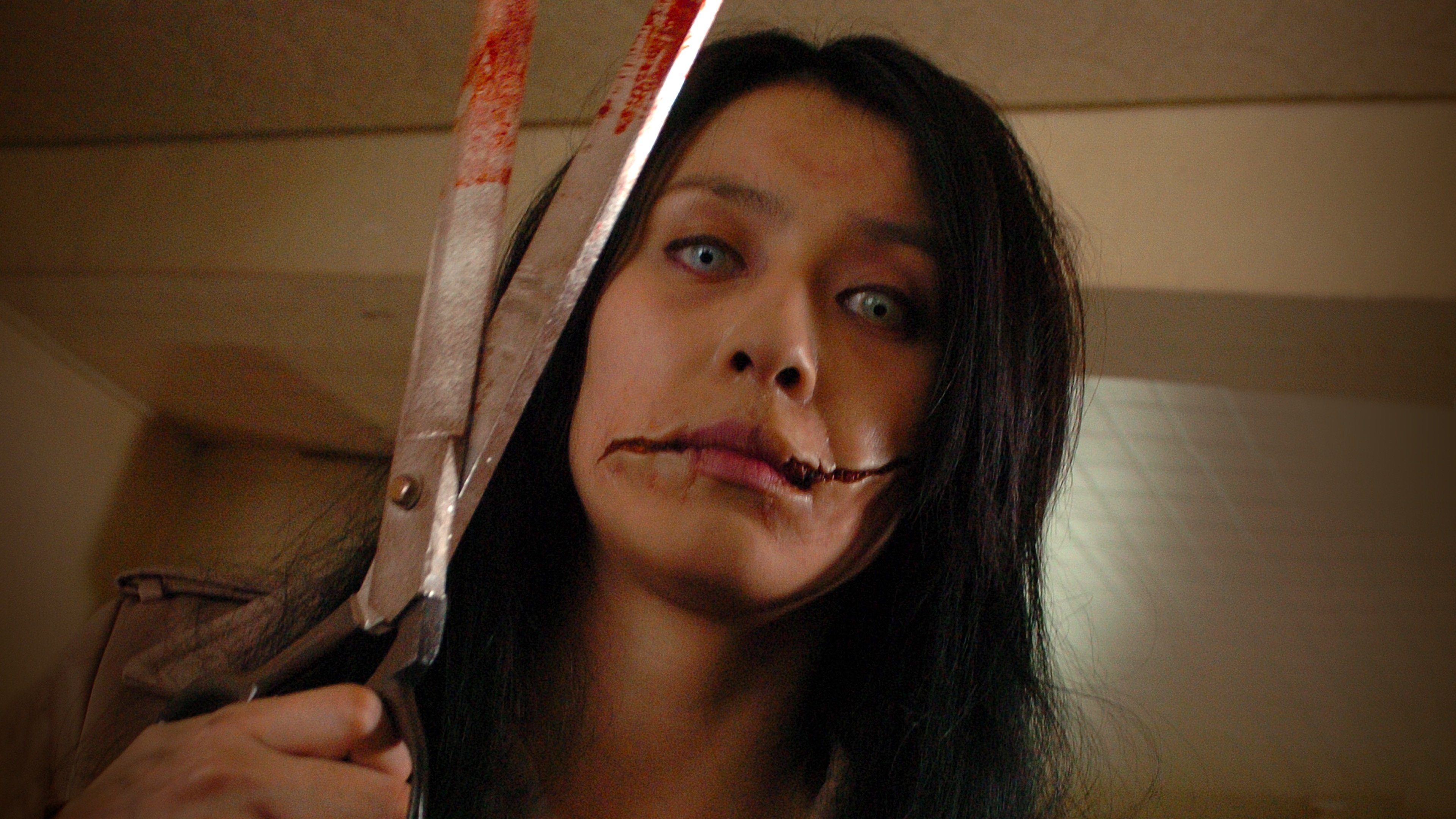 Carved: The Slit-Mouthed Woman Background