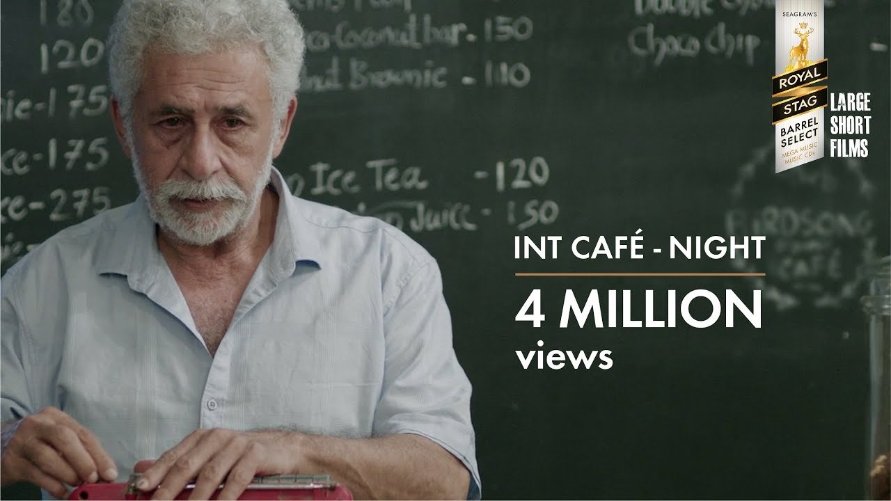INT. CAFÉ – NIGHT Background